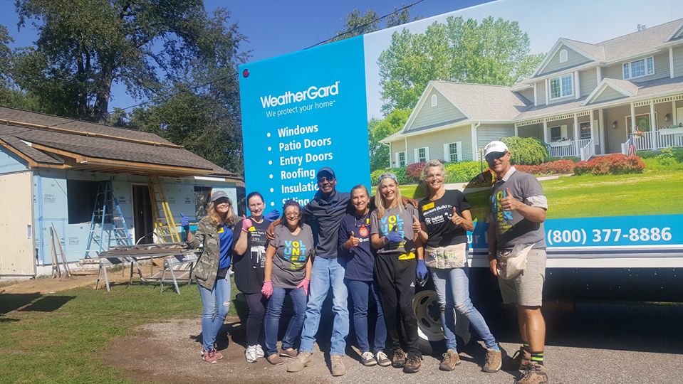 WeatherGard truck, and Steve, with Habitat volunteers at project house