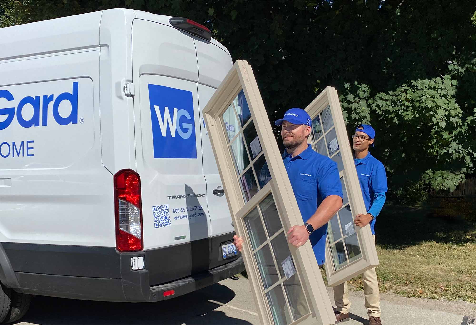WeatherGard installers unload new windows from a WeatherGard truck