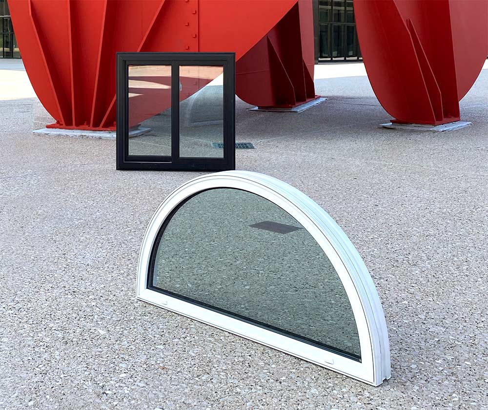 Half round and double-hung windows in front of modern art in Grand Rapids